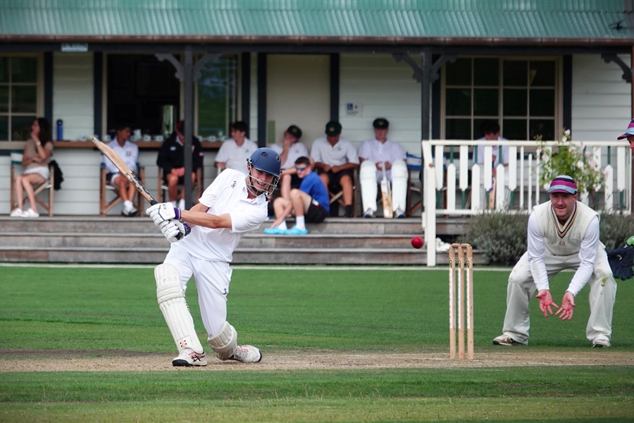 Xavior Nortman, playing for the Country Schools XI, frees the arms, with Brad Gordon looking on.